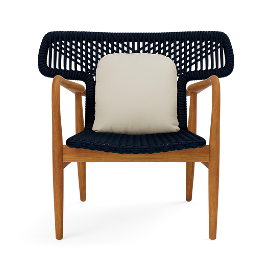 Chair with wooden frame and navy woven backrest and seat, featuring a cream leather cushion.