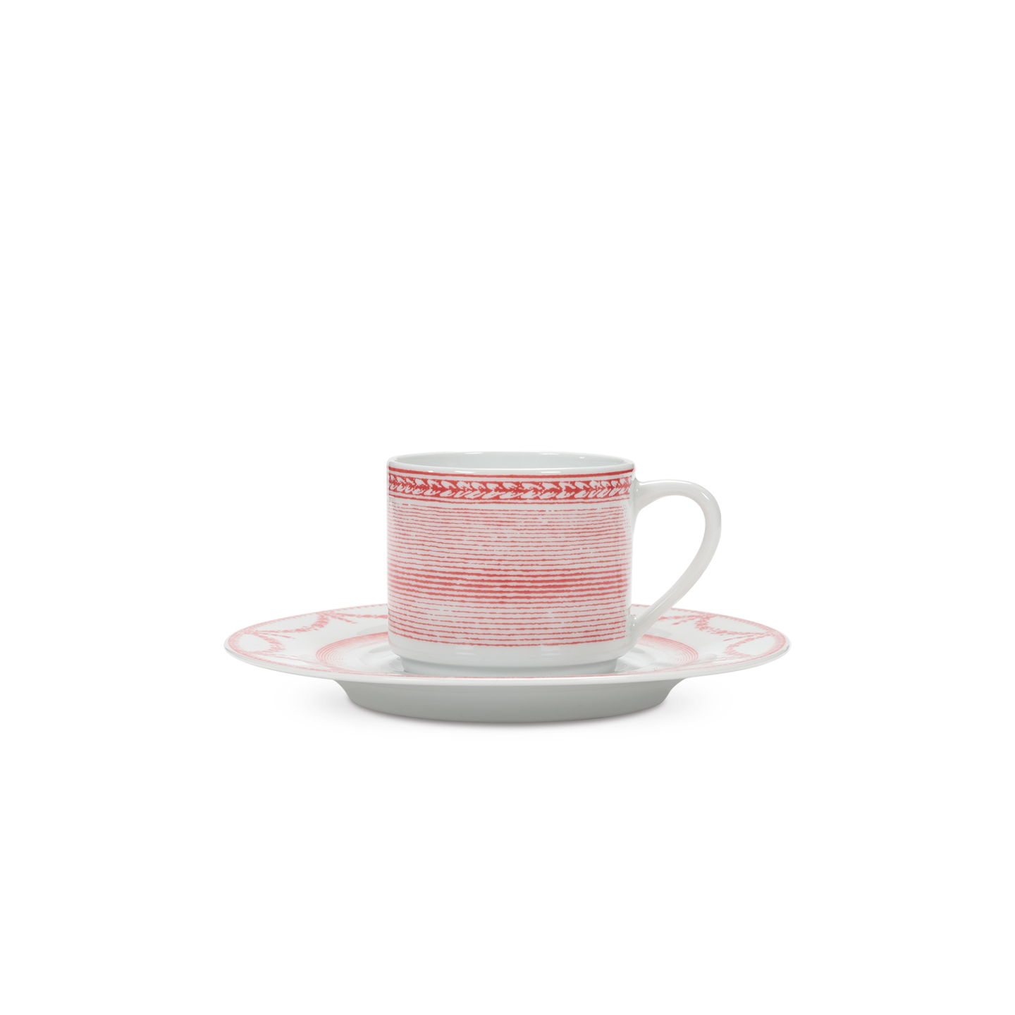Ceramic cup and saucer with red and white pattern on a white background