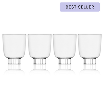 Four clear glasses with metal bases on a white background, labeled as a best seller.