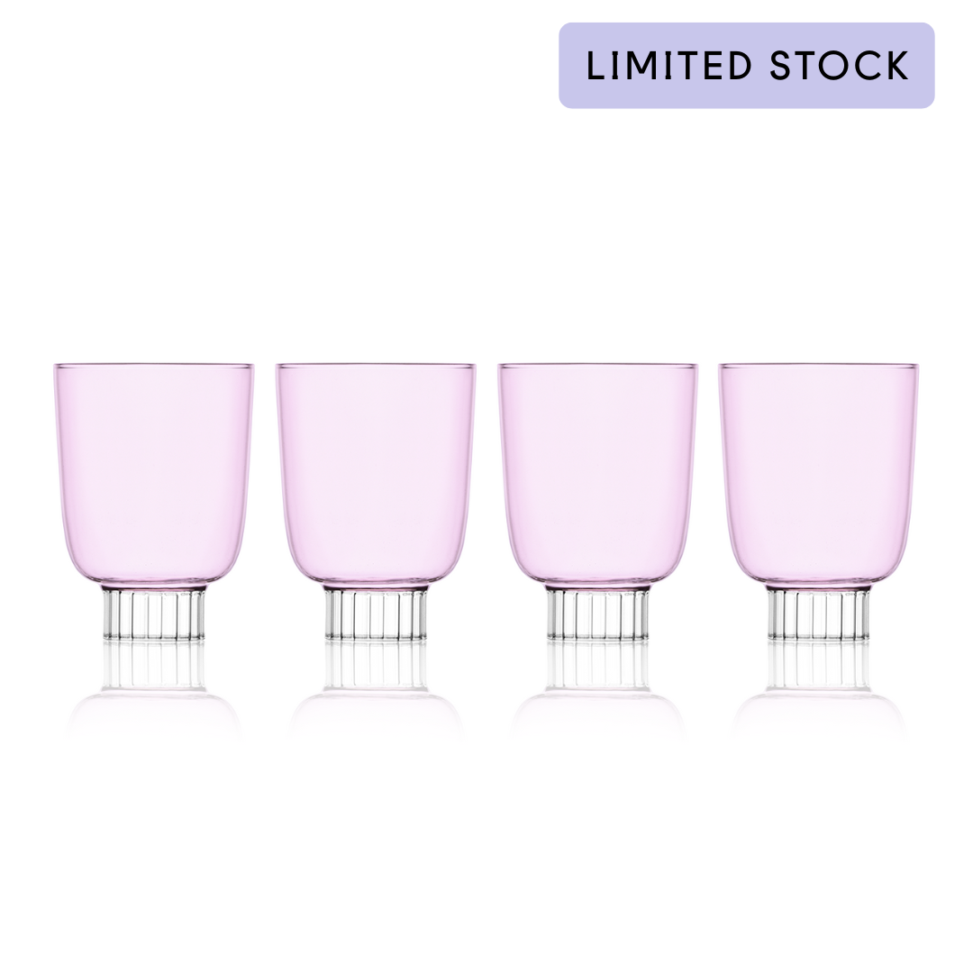 Four pink glasses with silver bases on a white background, labeled 'Limited Stock'.