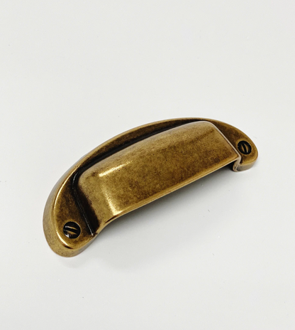 Bronze cabinet handle on a white background