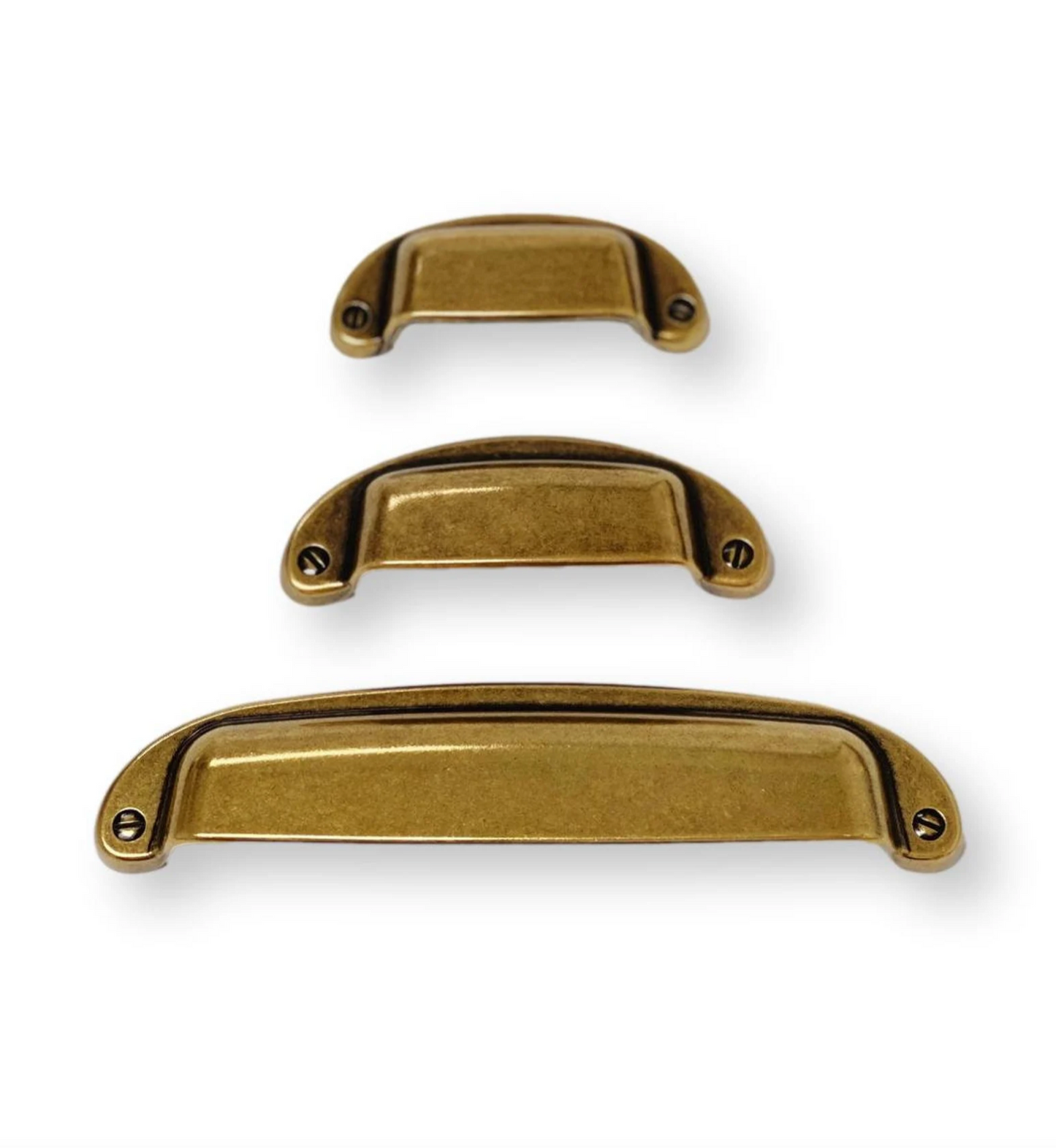 Three gold cabinet handles of different sizes on a white background