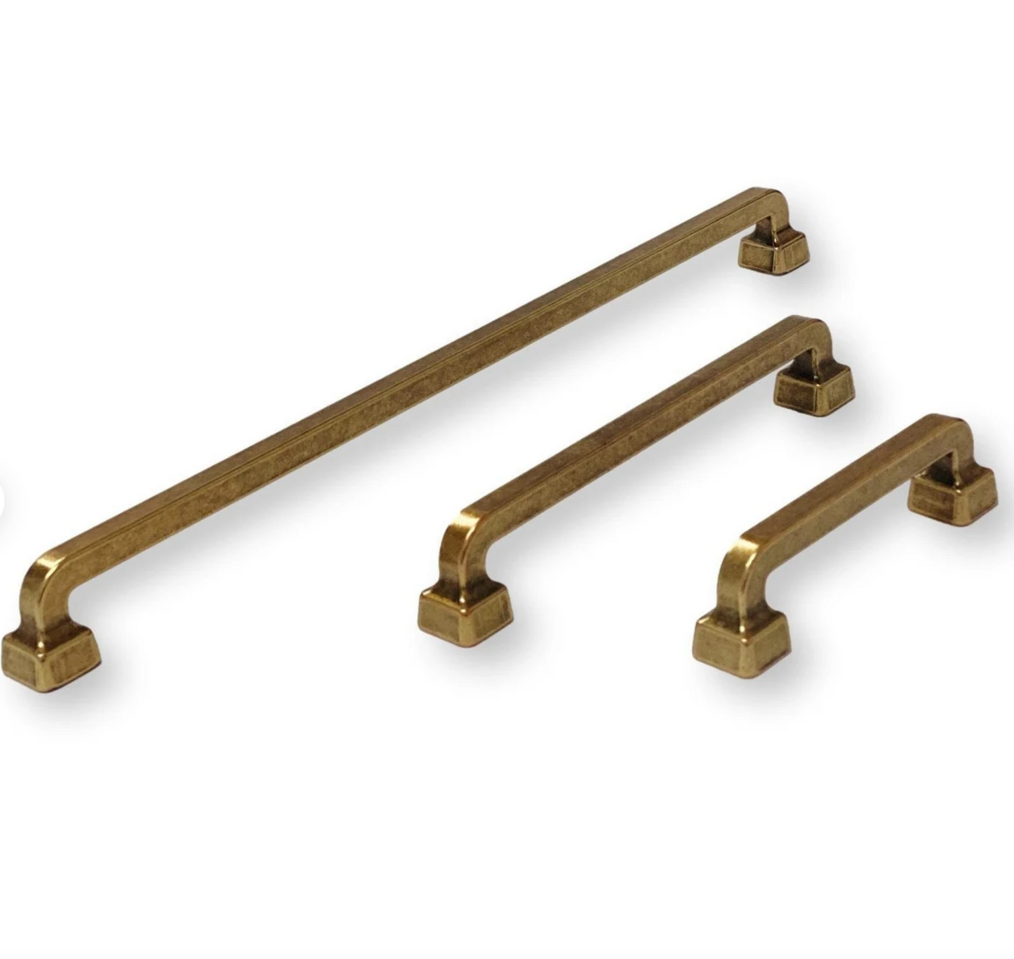 Set of gold cabinet handles on a white background