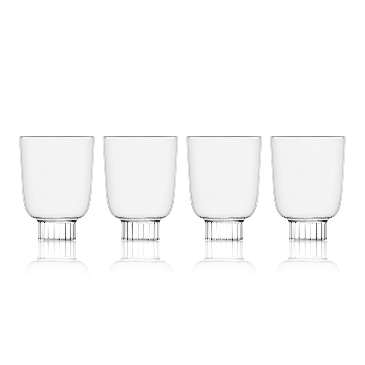 Four clear glasses with metal bases on a white background
