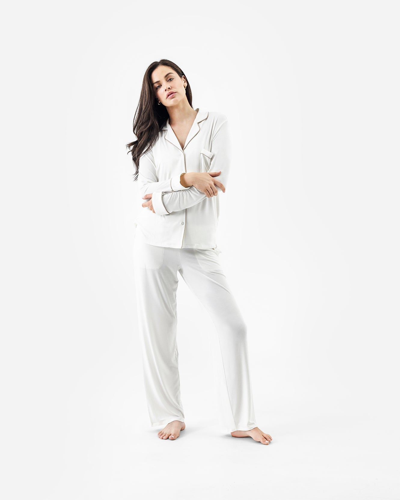 Woman wearing white pajamas on a white background