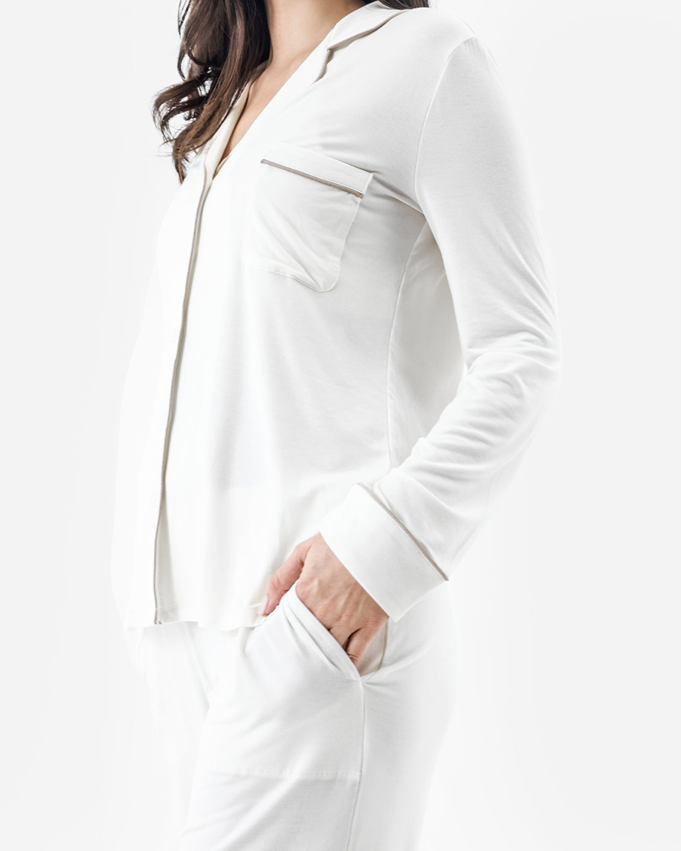 White long-sleeve top worn by a person on a white background