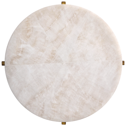 Round marble table with gold accents on a white background