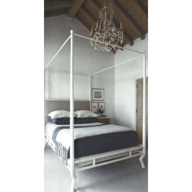 Bedroom with a canopy bed and crystal chandelier