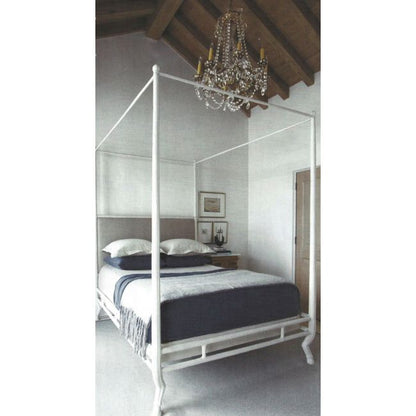Bedroom with a canopy bed and crystal chandelier