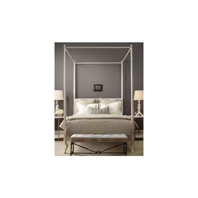 Bedroom with a canopy bed and gray walls