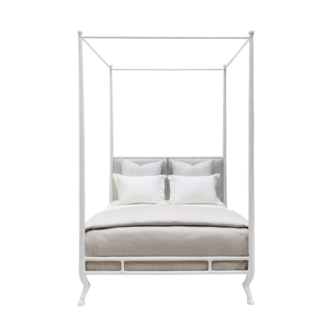 White metal canopy bed with bedding on a white background