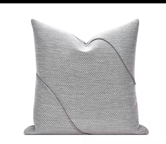 Gray textured pillow on a white background