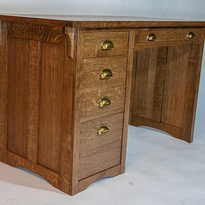 Wooden desk with gold handles on a white background