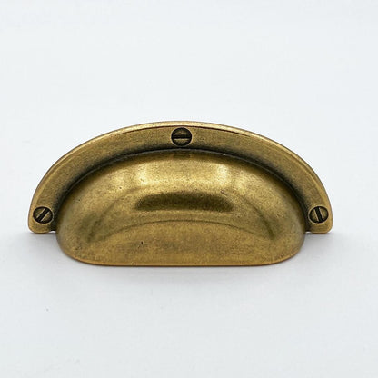 Brass cabinet handle on a white background