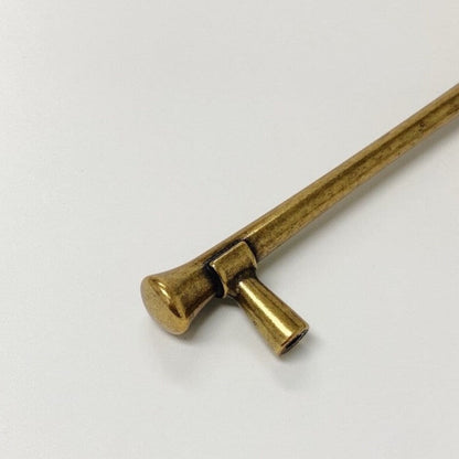 Brass hairpin on a white background