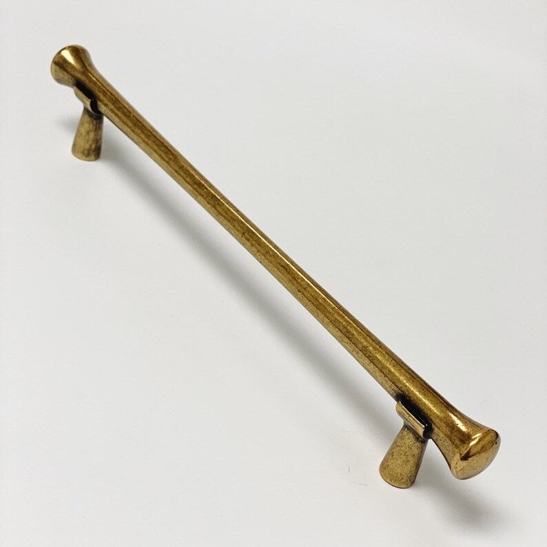 Gold metal handle on a white background