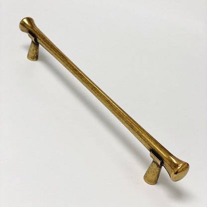 Gold metal handle on a white background