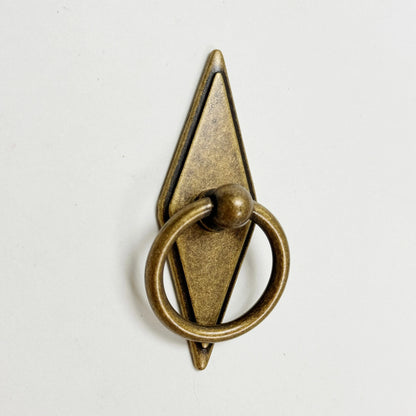 Bronze door knocker on a white background