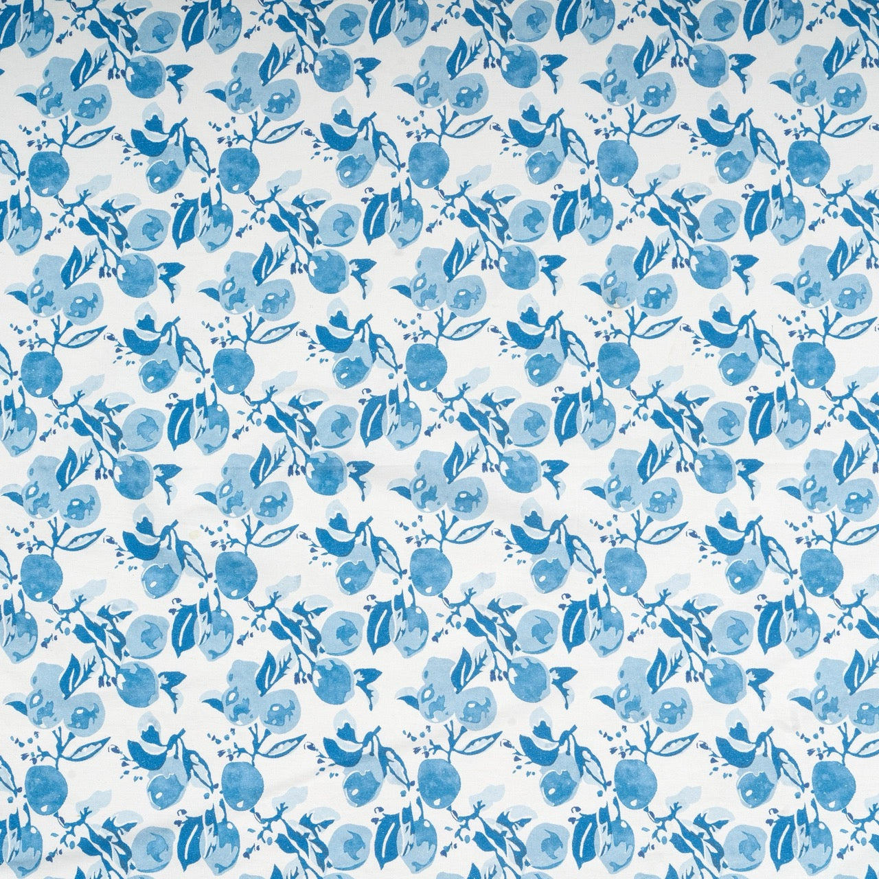 Pattern of blue flowers and leaves on a white background
