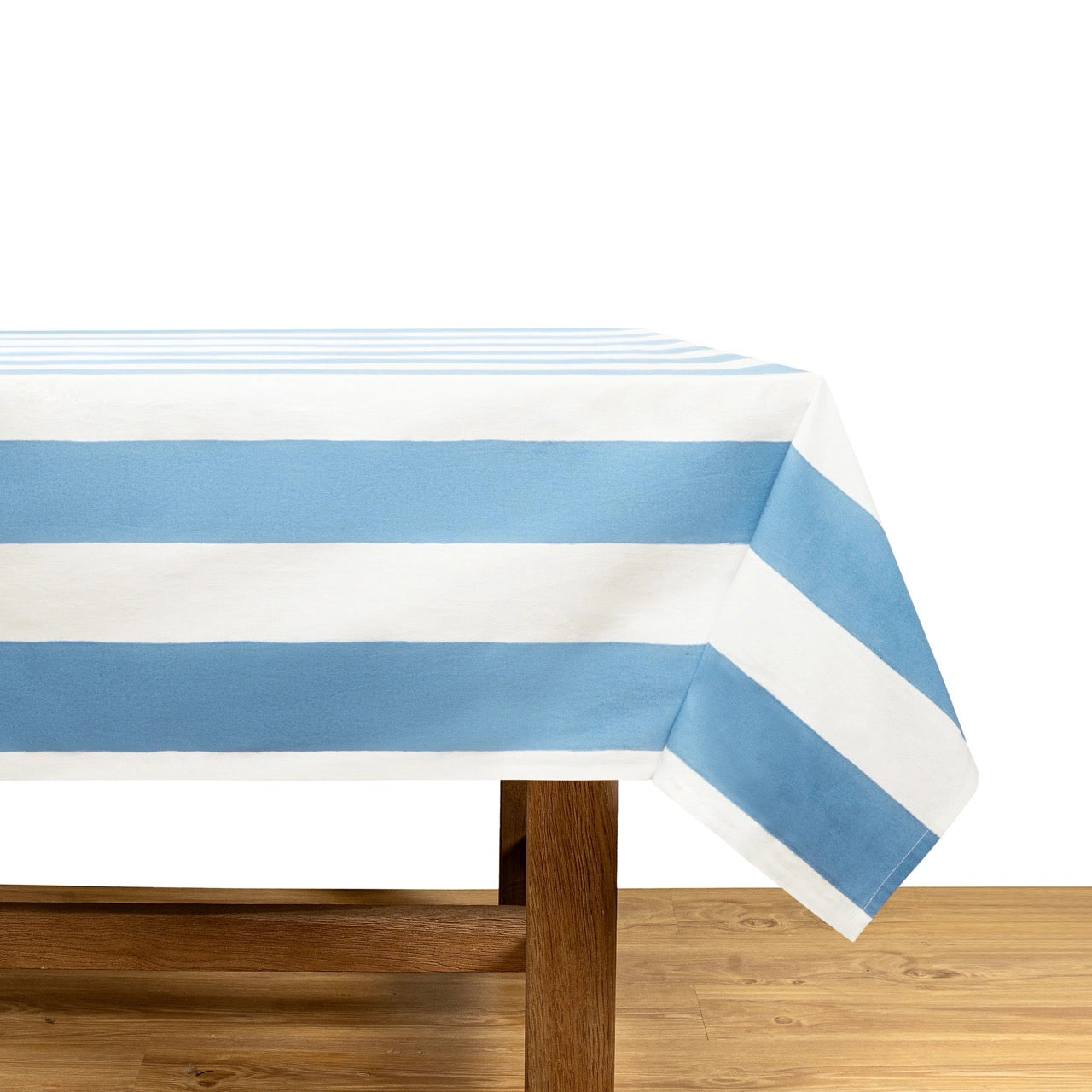 Tablecloth with blue and white stripes on a wooden table