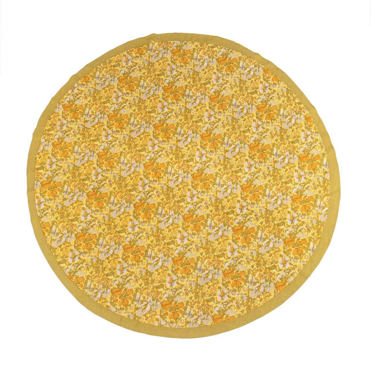 Round yellow rug with floral pattern on a white background