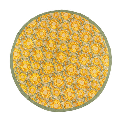 Round rug with yellow floral pattern on a white background