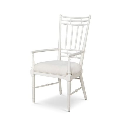 White chair with a cushioned seat on a white background