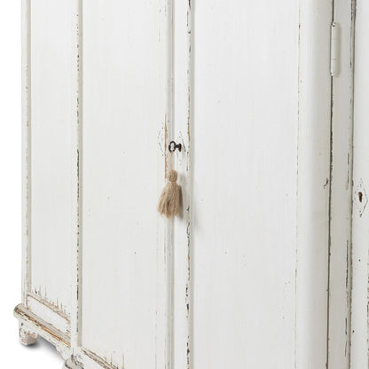 White distressed armoire with a tassel on a white background