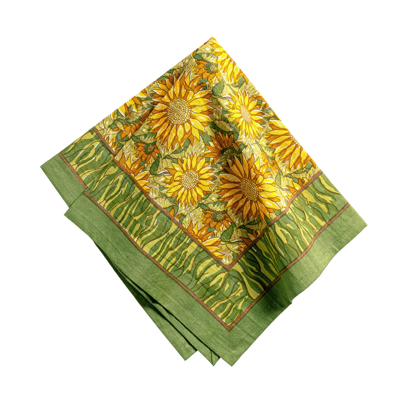 Green fabric with sunflower pattern on a white background
