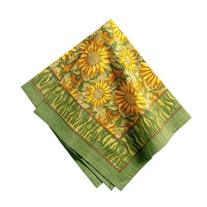 Green fabric with sunflower pattern on a white background