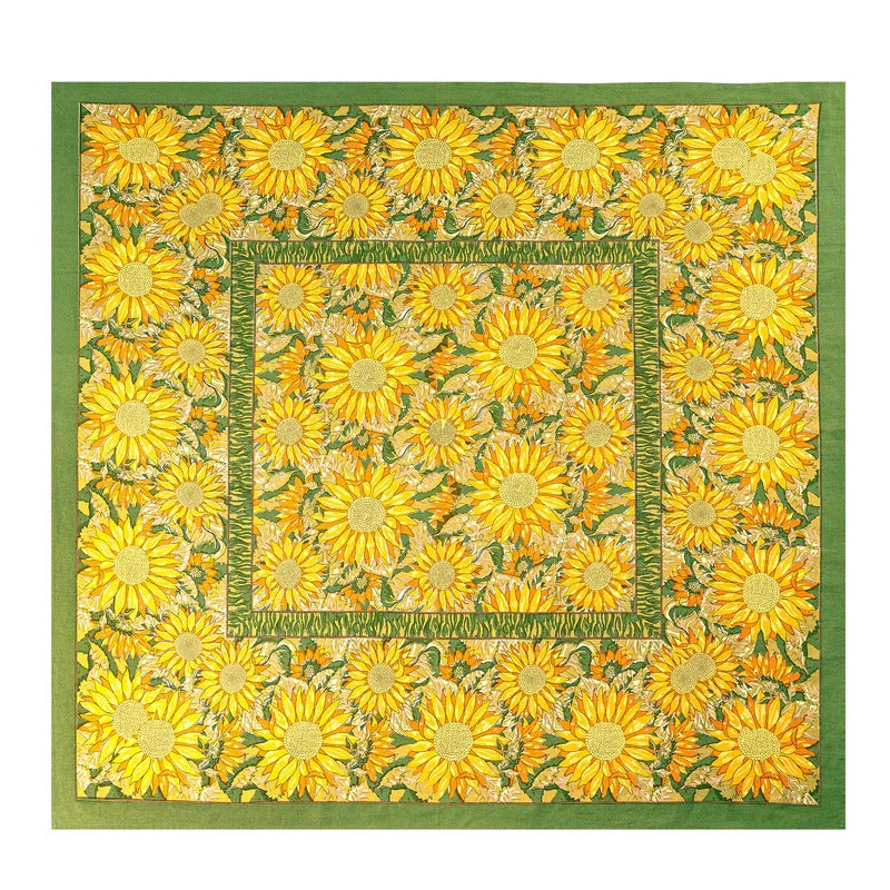 Quilt with sunflower pattern on a green background