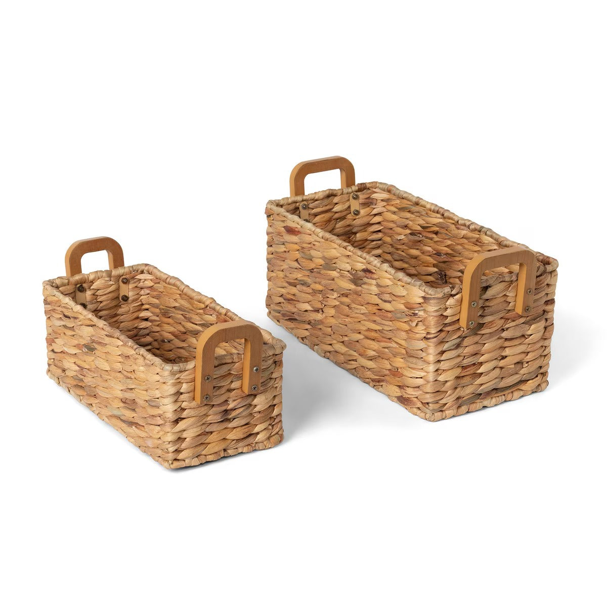 Two wicker baskets with handles on a white background