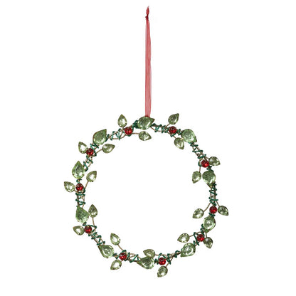 Decorative wreath ornament with green leaves and red berries on a white background
