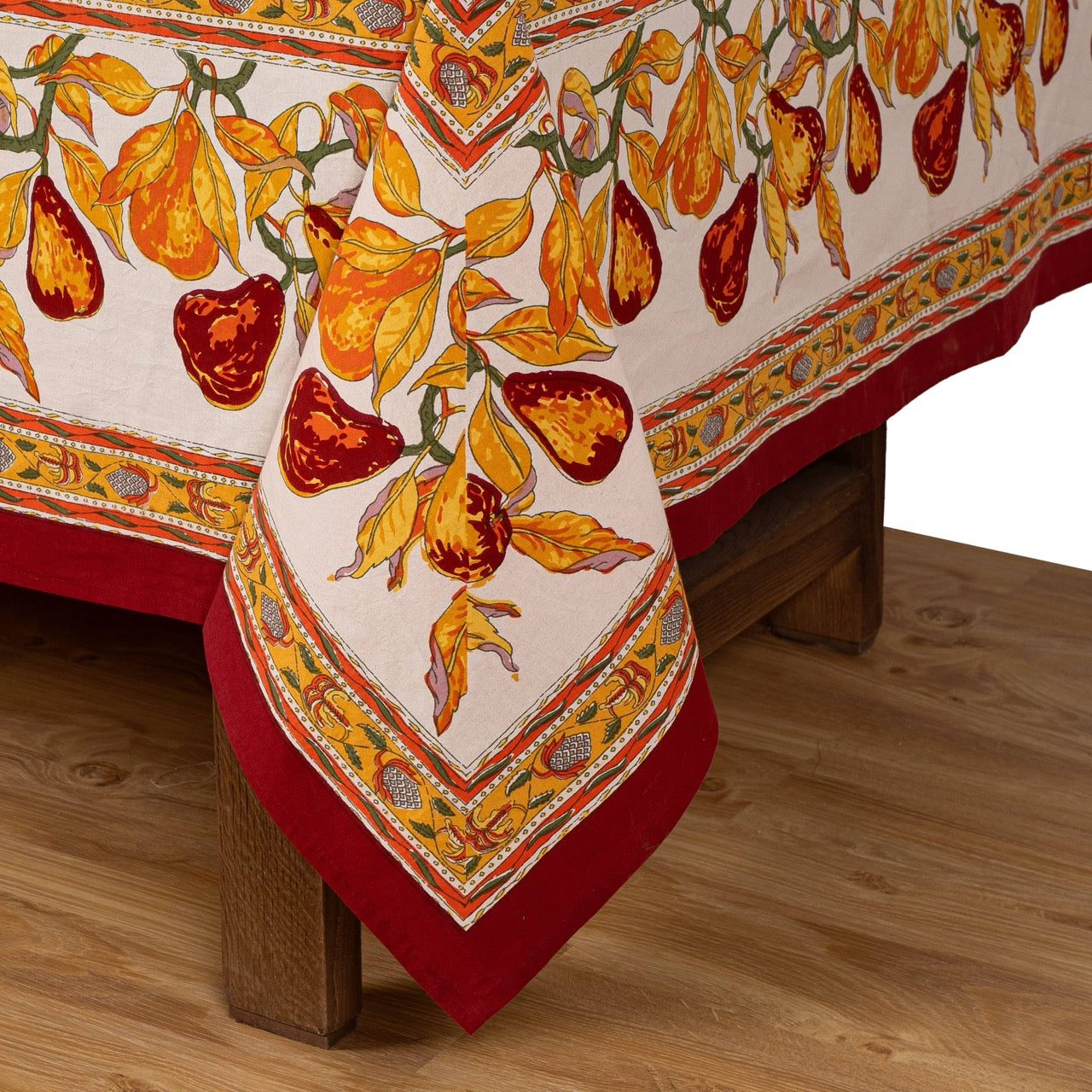 Decorative tablecloth with fruit pattern on a wooden table
