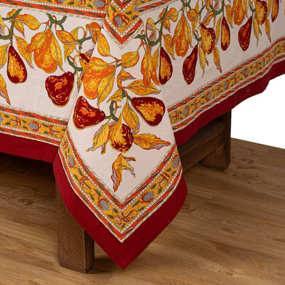 Decorative tablecloth with fruit pattern on a wooden table