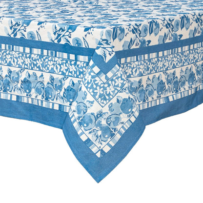 Blue and white patterned tablecloth with floral and striped designs on a white background