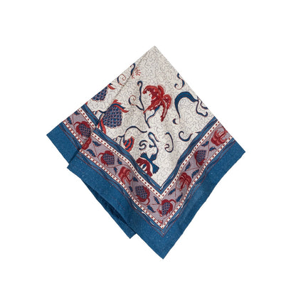 Decorative napkin with blue and red patterns on a white background