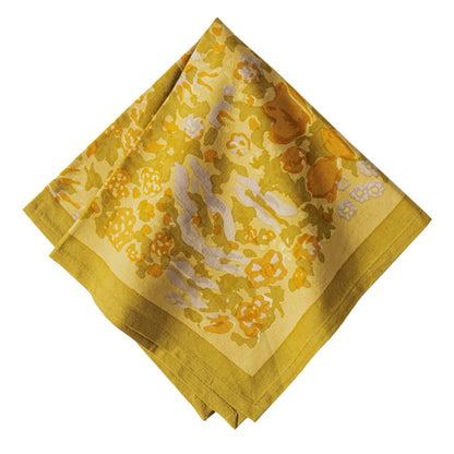 Yellow floral patterned fabric on a white background