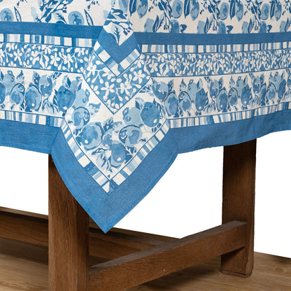 Blue and white patterned tablecloth on a wooden table