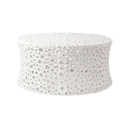 Round white cushion with gray circular pattern on a white background