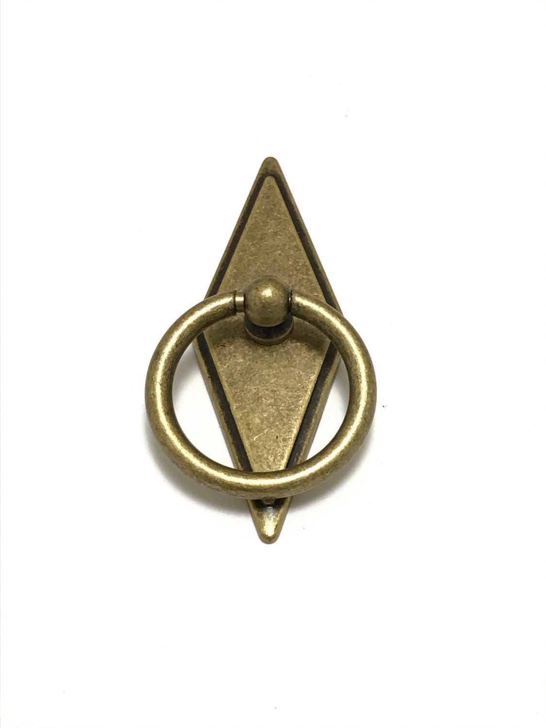 Brass door knocker with geometric design on a white background