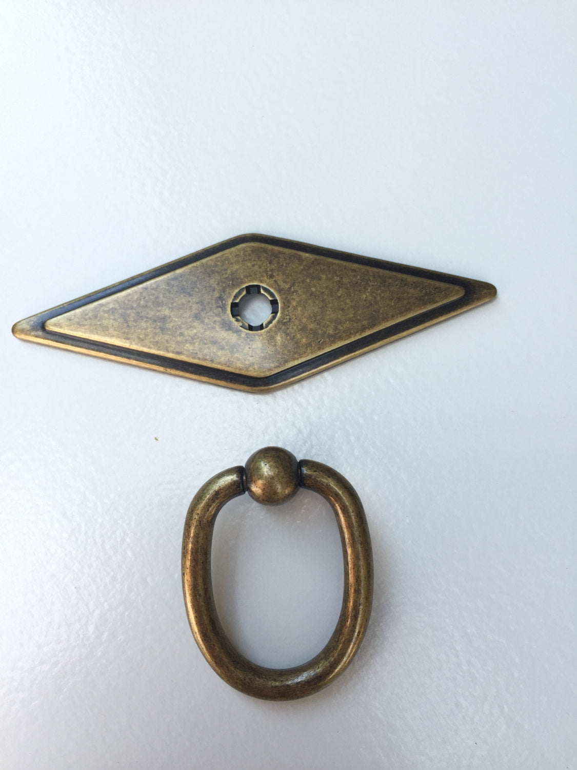 Brass door knocker on a white background